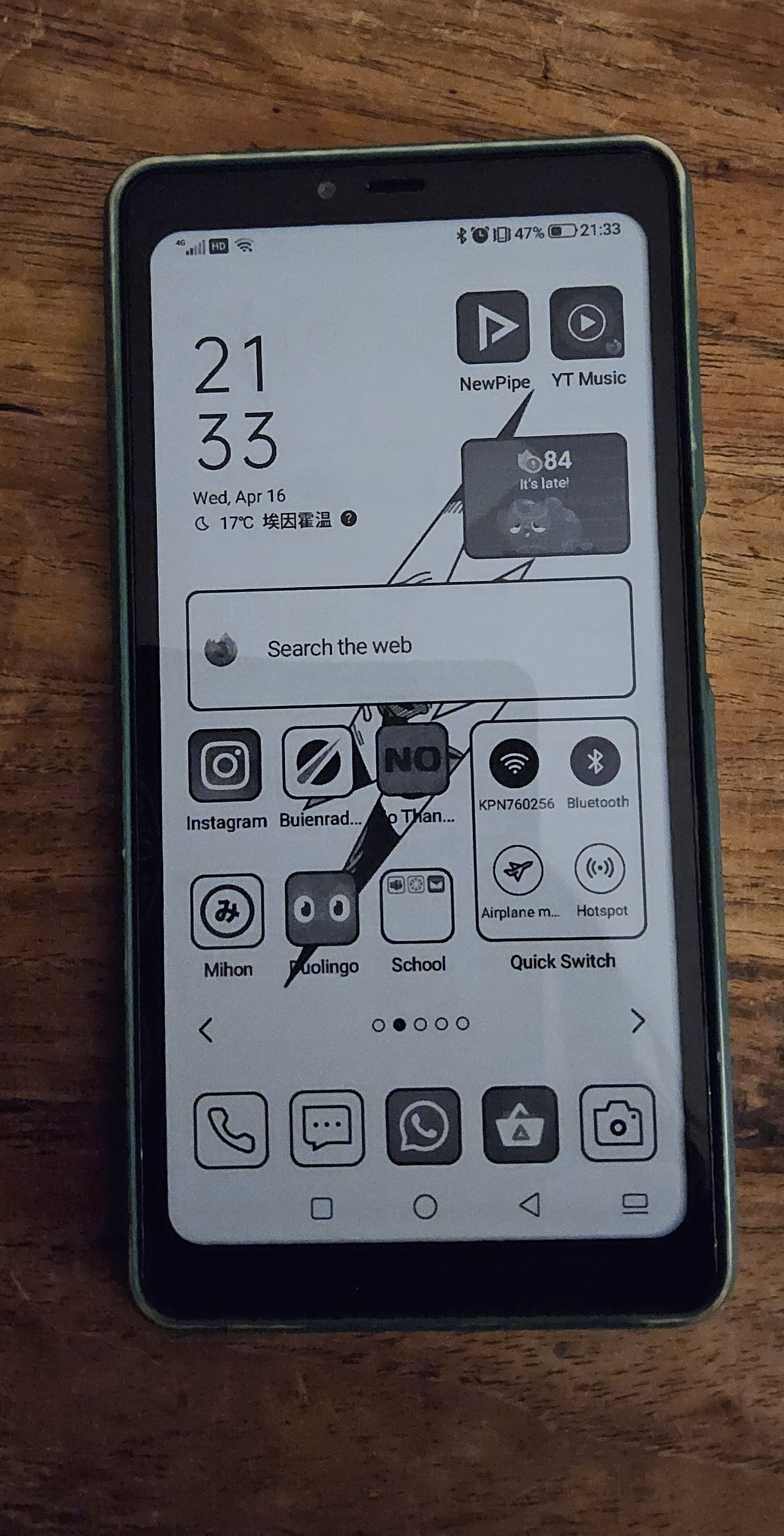 image of my main phone, a black and white ''dumbphone'' 